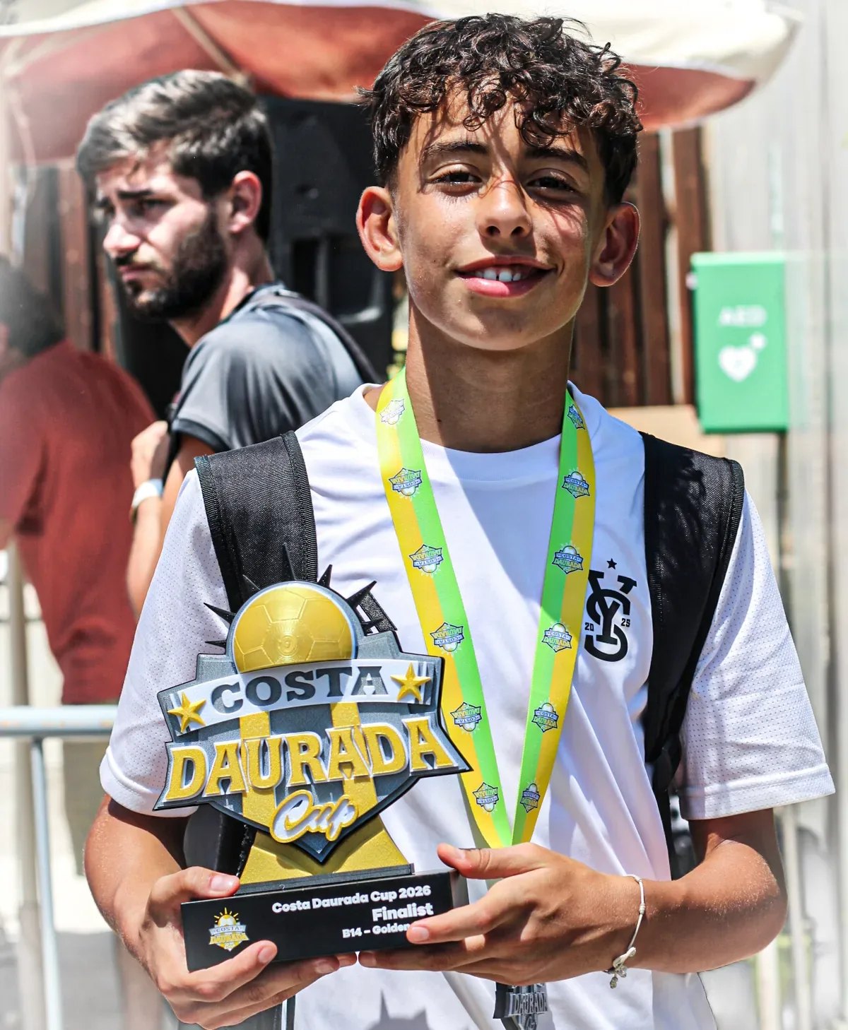 A CDC player with his Costa Daurada Cup finalist trophy